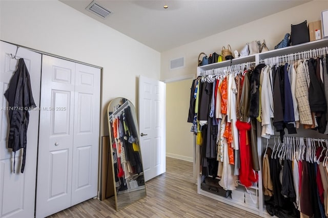 spacious closet with visible vents and light wood finished floors