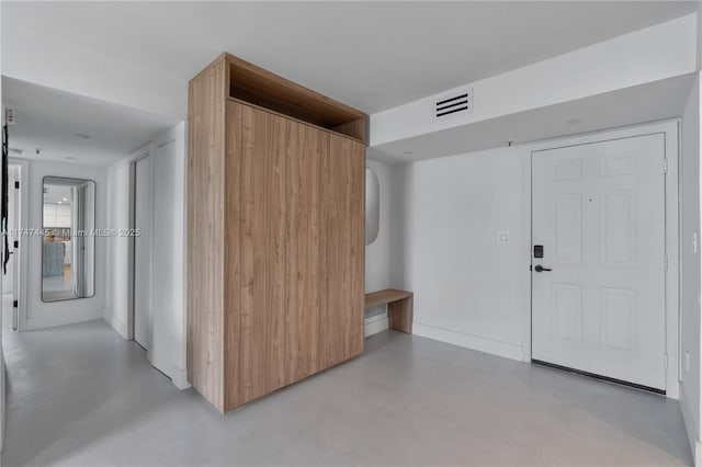 interior space featuring visible vents and concrete flooring