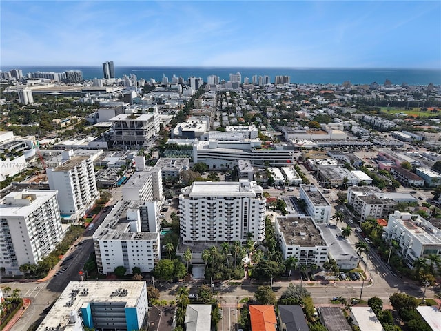 birds eye view of property featuring a view of city and a water view