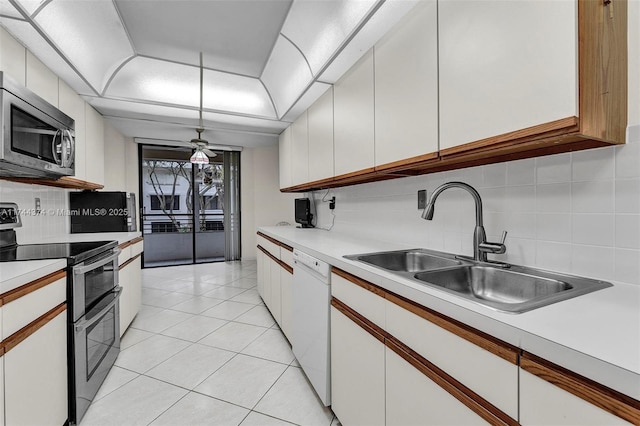 kitchen with white cabinets, stainless steel appliances, and hanging light fixtures