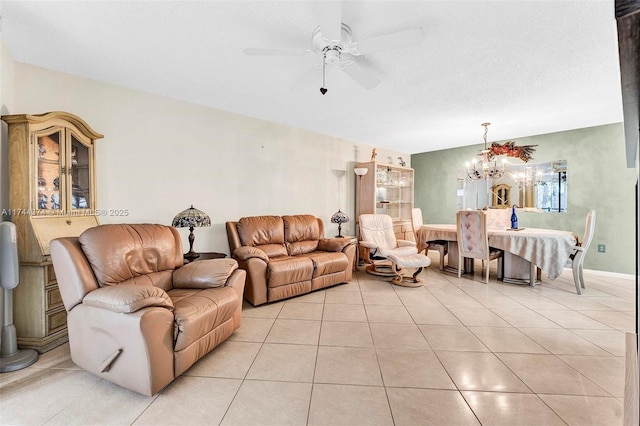 tiled living room featuring ceiling fan with notable chandelier