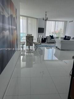 150 Sunny Isles Blvd Unit 1-606, Sunny Isles Beach, FL 33160 - living room featuring a chandelier
