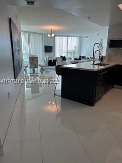 150 Sunny Isles Blvd Unit 1-606, Sunny Isles Beach, FL 33160 - kitchen with light countertops, dishwasher, and light tile patterned floors