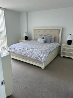 150 Sunny Isles Blvd Unit 1-606, Sunny Isles Beach, FL 33160 - bedroom with carpet flooring