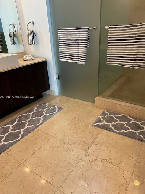 150 Sunny Isles Blvd Unit 1-606, Sunny Isles Beach, FL 33160 - full bath featuring vanity, a shower stall, and marble finish floors