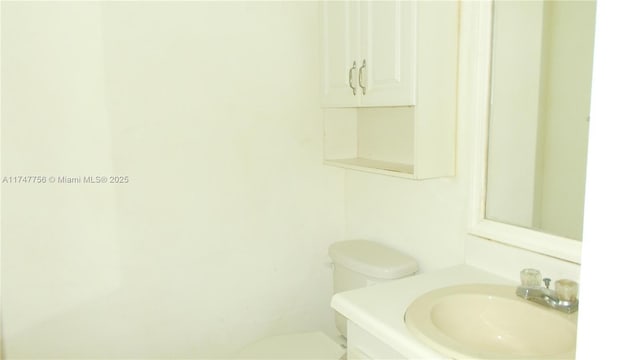 bathroom featuring sink and toilet