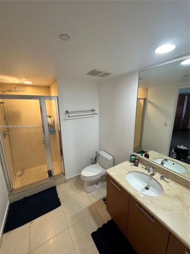 50 Biscayne Blvd Unit 3505, Miami, FL 33132 - full bathroom with tile patterned floors, a stall shower, vanity, toilet, and baseboards