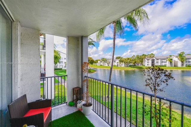 balcony featuring a water view