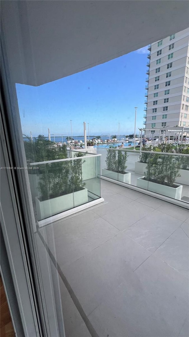 balcony featuring a water view