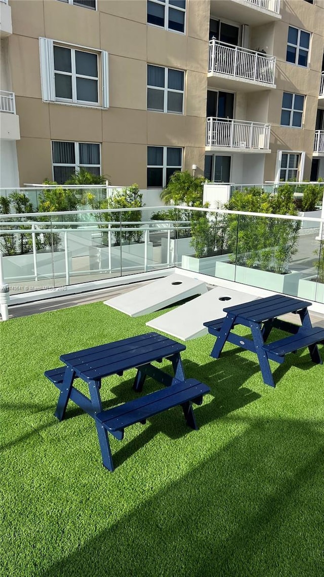 view of property's community featuring a yard