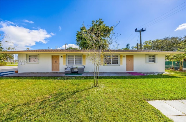 single story home with a front lawn