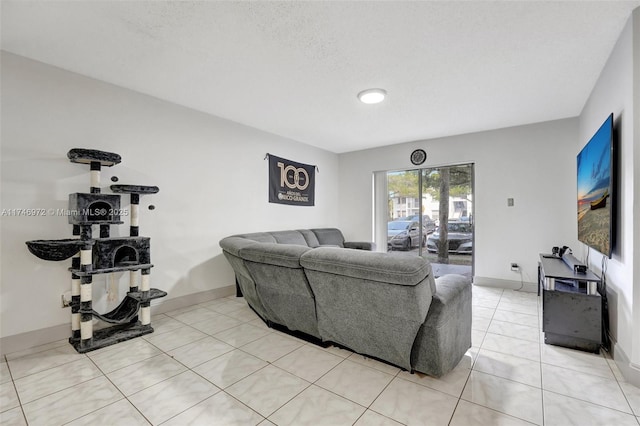 tiled living room featuring a textured ceiling