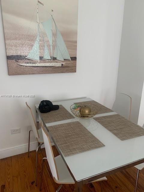 unfurnished dining area featuring hardwood / wood-style floors