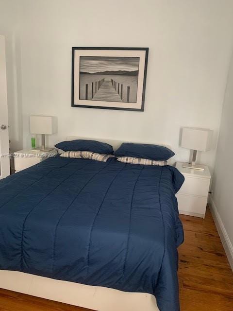 bedroom with wood-type flooring