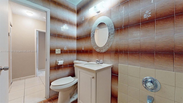 bathroom with tile patterned floors, toilet, and vanity