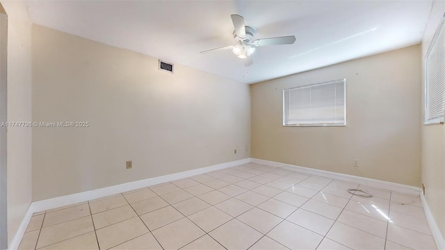 unfurnished room featuring ceiling fan and light tile patterned floors