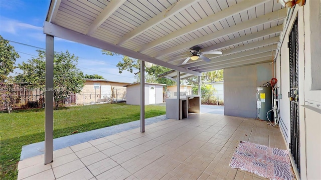 view of patio / terrace featuring a storage unit, ceiling fan, and water heater