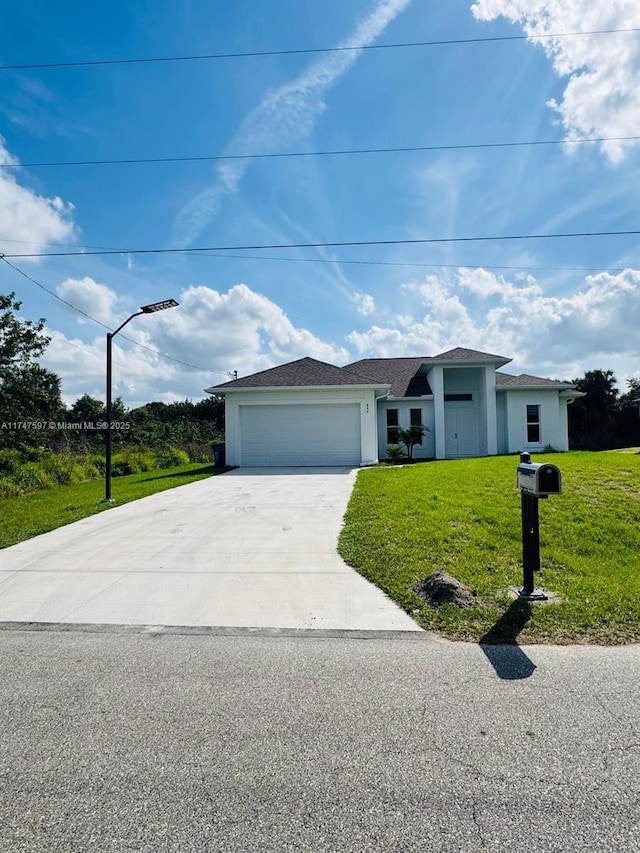 single story home featuring a front yard and a garage