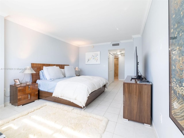 bedroom featuring baseboards, visible vents, crown molding, and light tile patterned flooring