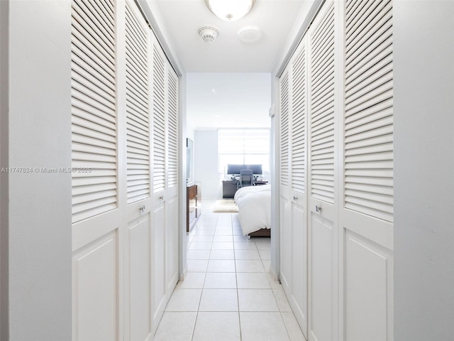 corridor featuring light tile patterned floors