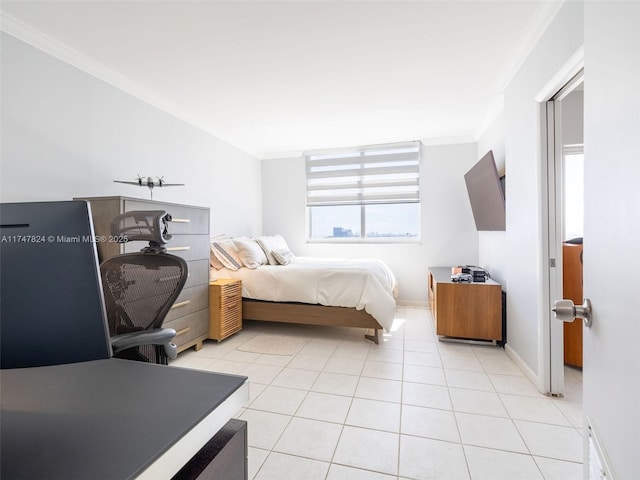 bedroom featuring light tile patterned floors, ornamental molding, and baseboards