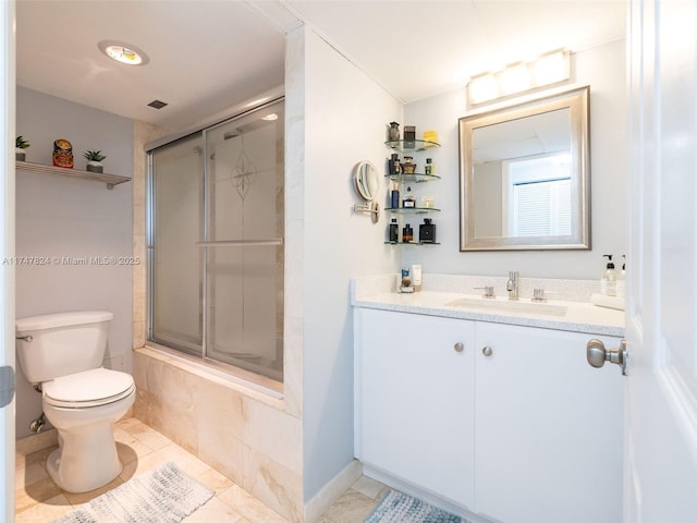 full bathroom with toilet, vanity, baseboards, and tile patterned floors