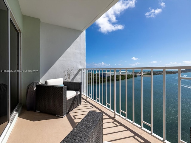 balcony featuring a water view