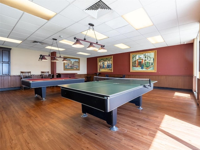 recreation room featuring billiards, visible vents, a drop ceiling, wainscoting, and wood finished floors