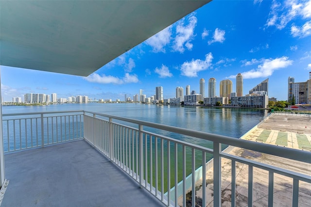 balcony featuring a water view