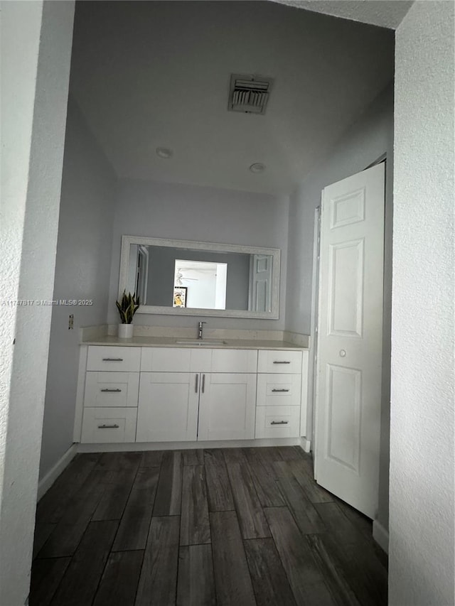 bathroom with vanity and wood-type flooring