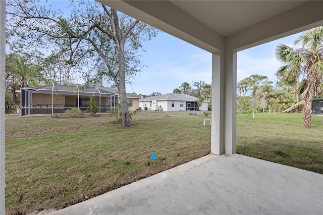 view of yard with a patio area and a lanai