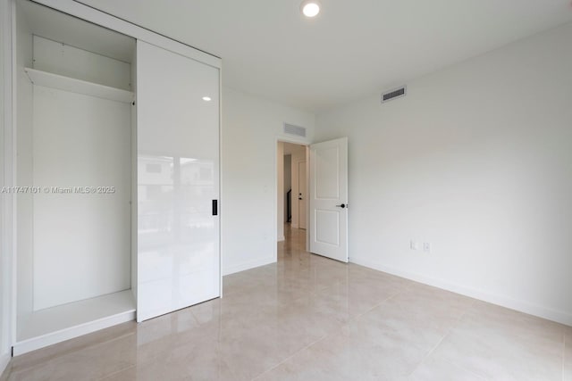 unfurnished bedroom with recessed lighting, baseboards, and visible vents