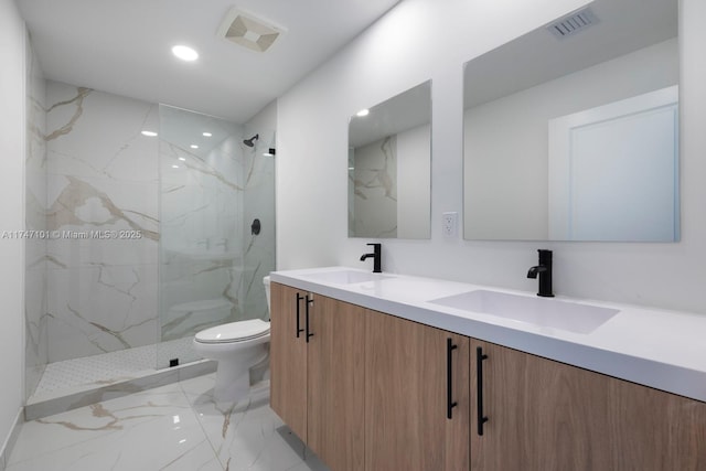 bathroom featuring toilet, visible vents, marble finish floor, and a sink