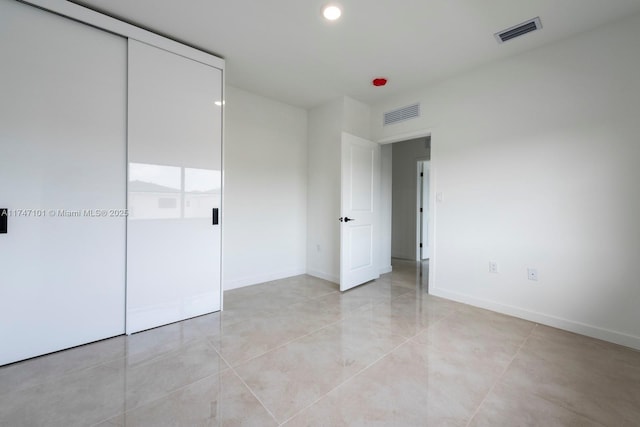 unfurnished bedroom with visible vents, recessed lighting, and baseboards