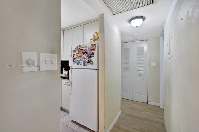 corridor featuring light hardwood / wood-style flooring