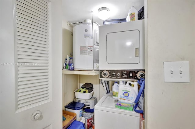 laundry room with stacked washer / dryer and water heater