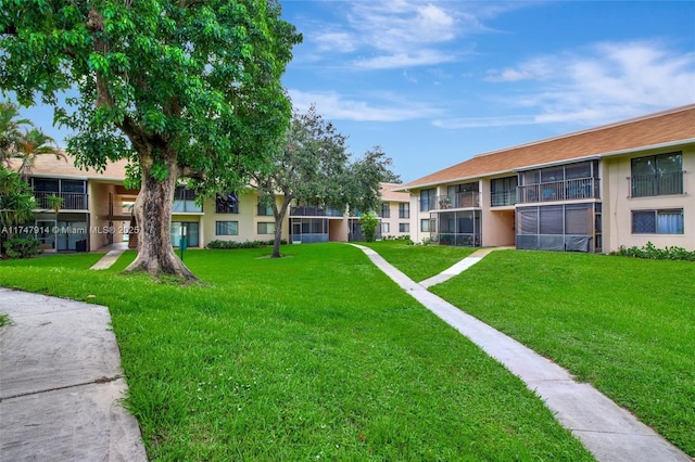 view of community featuring a yard