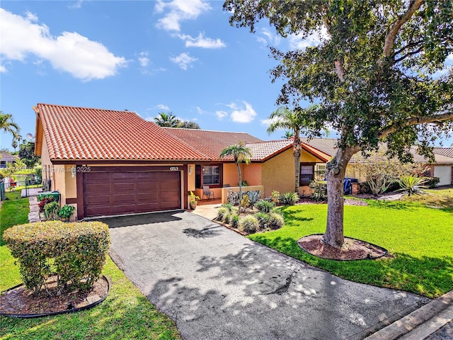 ranch-style home featuring a front lawn and a garage