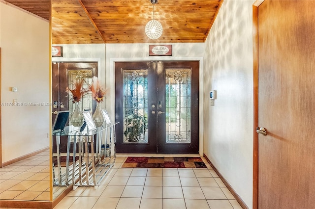 653 NW 110th Ave, Coral Springs, FL 33071 - tiled entryway with french doors, wooden ceiling, and vaulted ceiling
