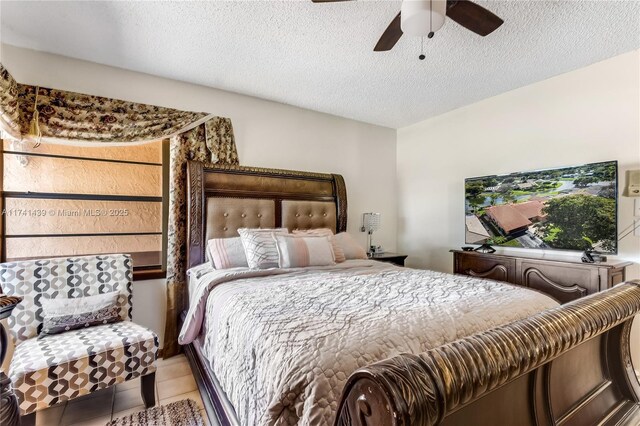 653 NW 110th Ave, Coral Springs, FL 33071 - tiled bedroom with a textured ceiling and ceiling fan