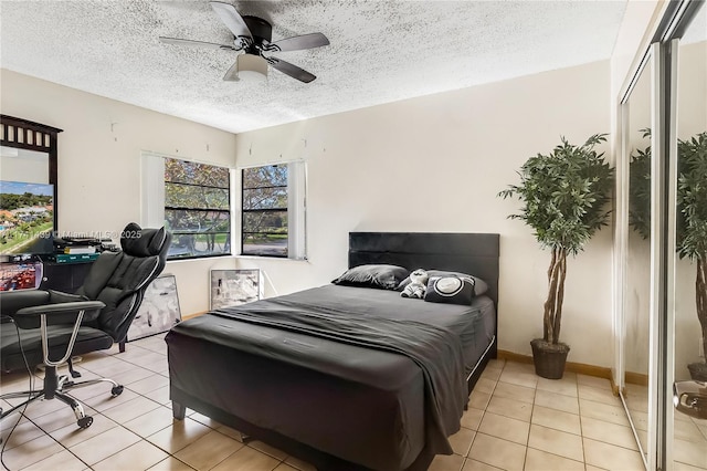653 NW 110th Ave, Coral Springs, FL 33071 - tiled bedroom featuring ceiling fan and a textured ceiling
