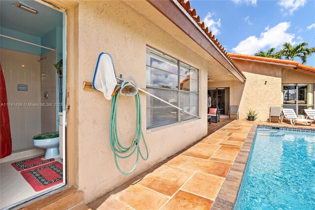 653 NW 110th Ave, Coral Springs, FL 33071 - view of swimming pool with a patio area