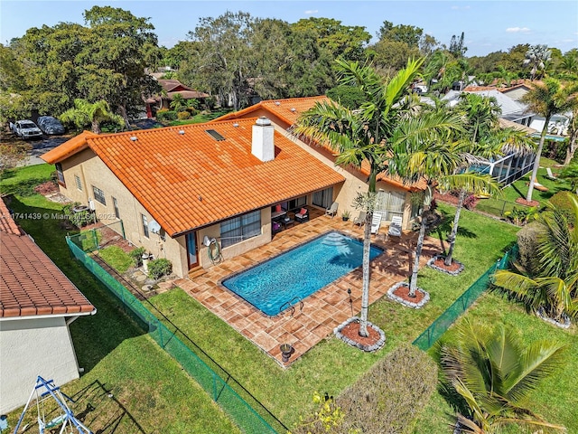 653 NW 110th Ave, Coral Springs, FL 33071 - view of swimming pool with a patio and a lawn