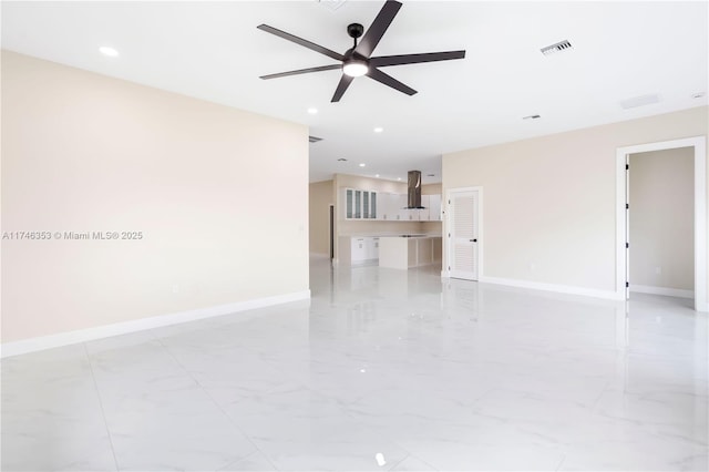 unfurnished living room with ceiling fan