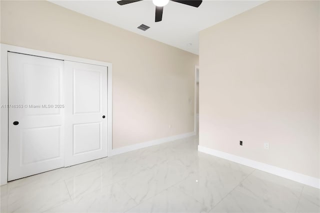 unfurnished bedroom featuring a closet and ceiling fan