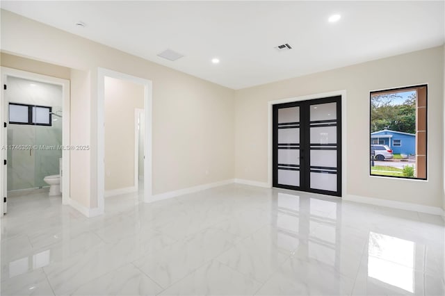 empty room featuring french doors