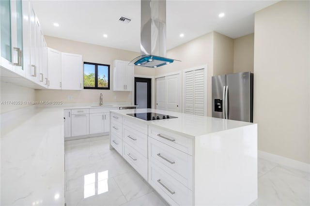 kitchen with stainless steel fridge with ice dispenser, a kitchen island, black electric cooktop, white cabinets, and island exhaust hood