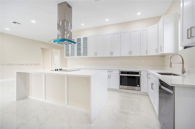 kitchen with island range hood, white cabinetry, and black appliances