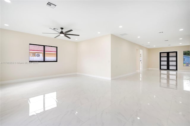 spare room featuring ceiling fan