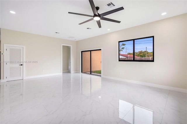 spare room with ceiling fan